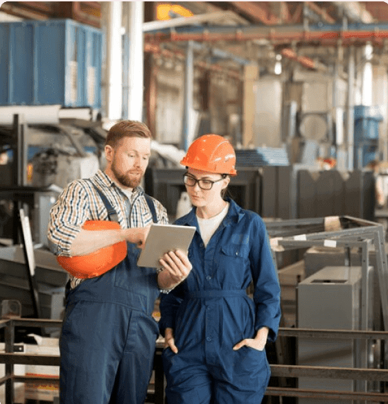 Logistics partners reviewing shipment details in a warehouse